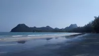 The jungle-clad limestone outcrops of Ao Manao beach